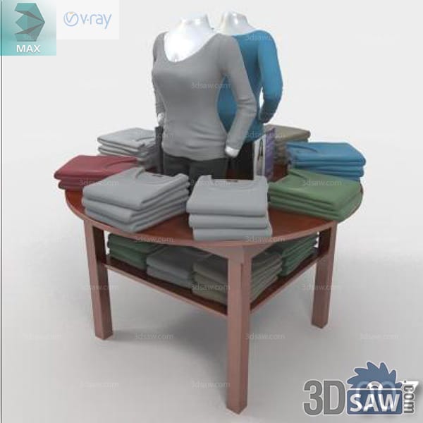 Two torso mannequins above a round table of folded colorful knitwear