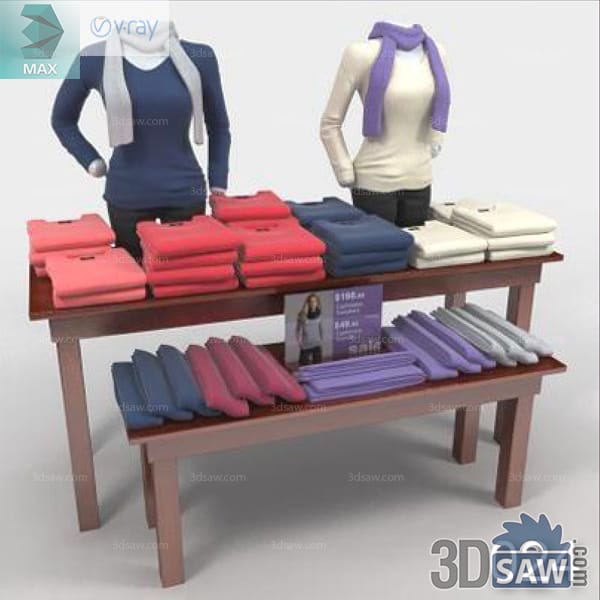 Two scarf-wearing torso mannequins behind tables of colorful folded knitwear