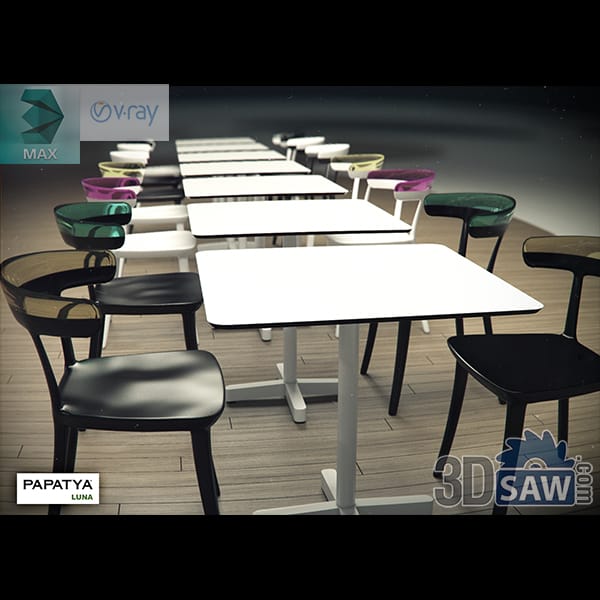 Contemporary restaurant tables with dark chairs and colorful accent seating