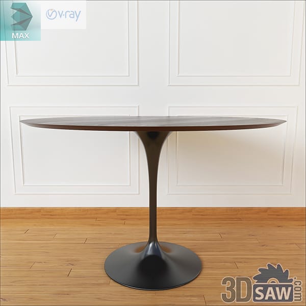 Mid-century round walnut dining table with a black pedestal base