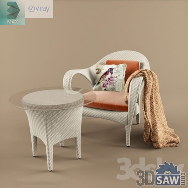 Rustic white wicker armchair and round side table with coral cushions