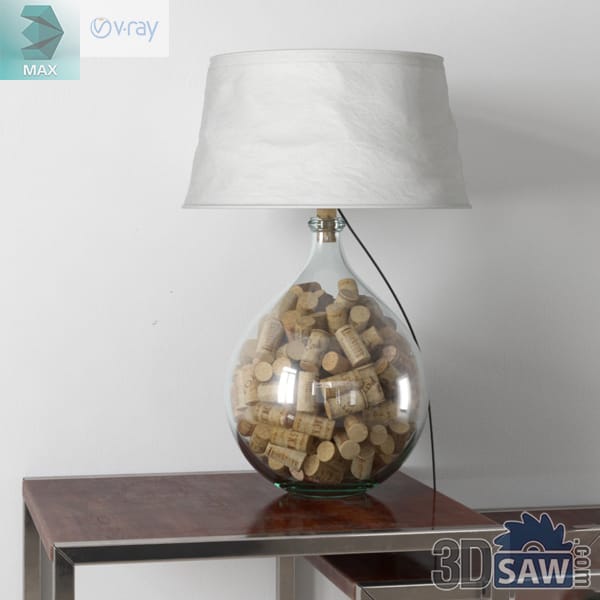Table lamp with a clear glass base full of wine corks and a crushed off-white drum shade