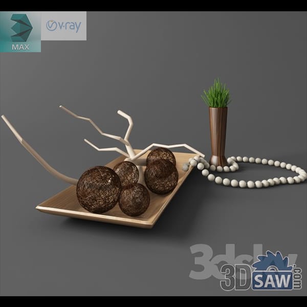 Rattan ball and branch decor set with prayer beads and a small grass vase on a wooden tray