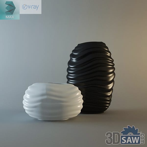 Black and white ribbed wave-form vases with rippling textured surfaces