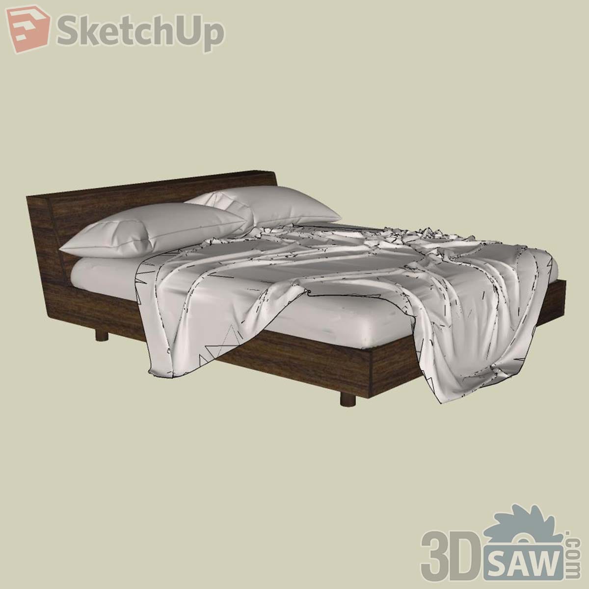 Modern dark walnut bed with low headboard, block legs and a pulled-back white sheet
