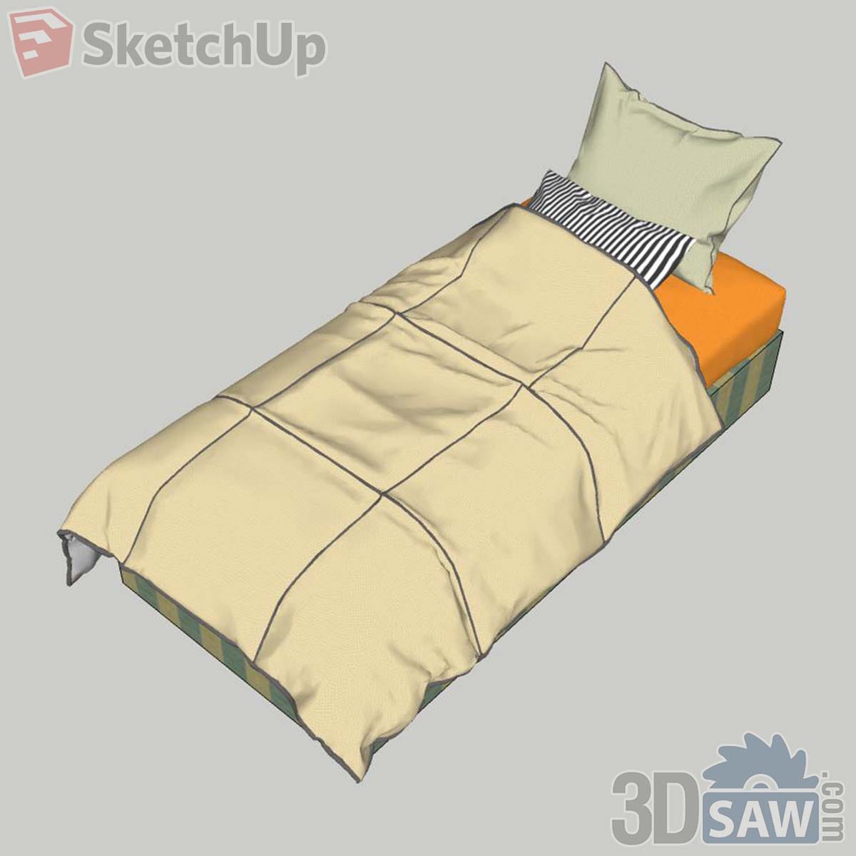 Single bed with cream panelled duvet, orange fitted sheet and striped green base
