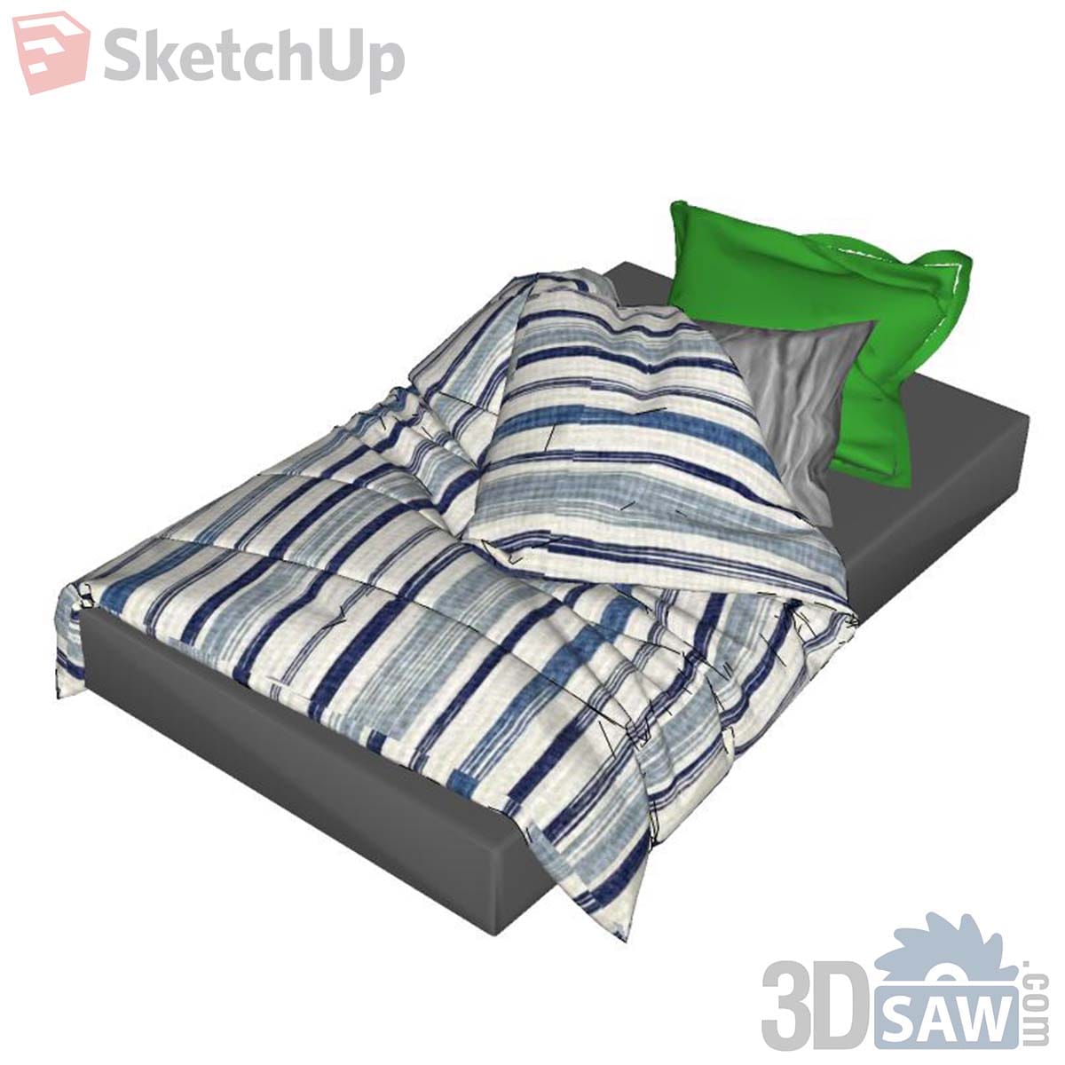 Low charcoal single mattress with blue and white striped duvet and a bright green pillow