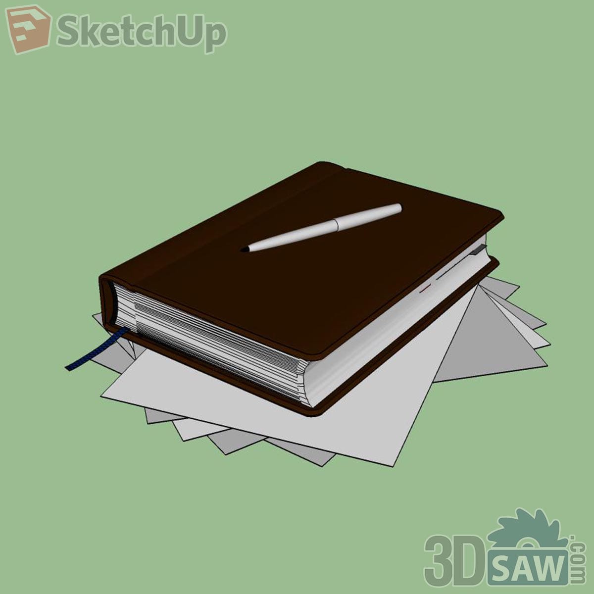 Dark brown leather notebook with silver pen on top, resting on scattered loose sheets